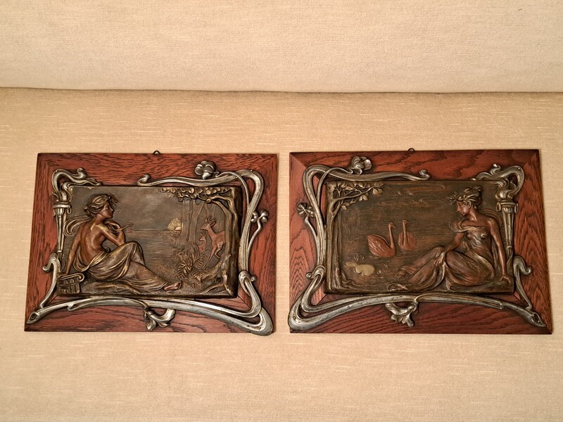 Pair of art nouveau regula bas-relief plaques in wooden frame