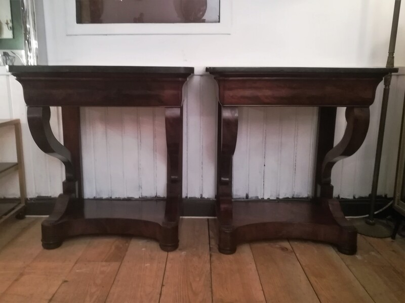 Pair of mahogany and black granite Restoration consoles  