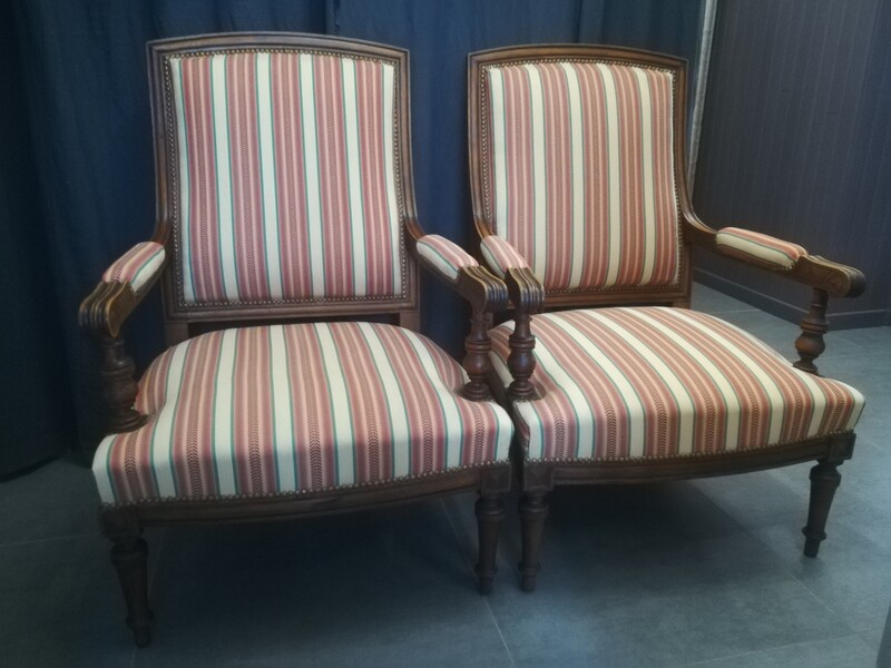 Paire of upholstered Louis XVI style walnut armchairs