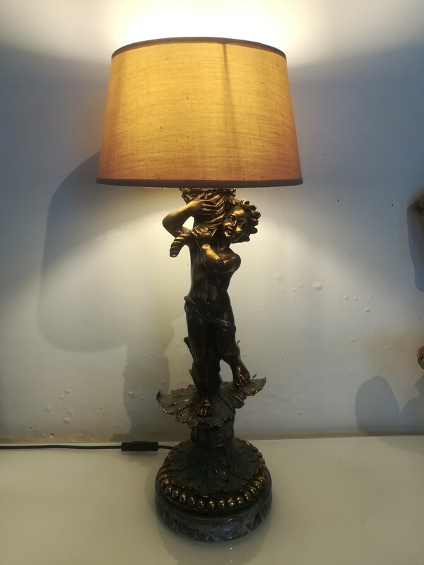 Patinated metal and marble cherub lamp