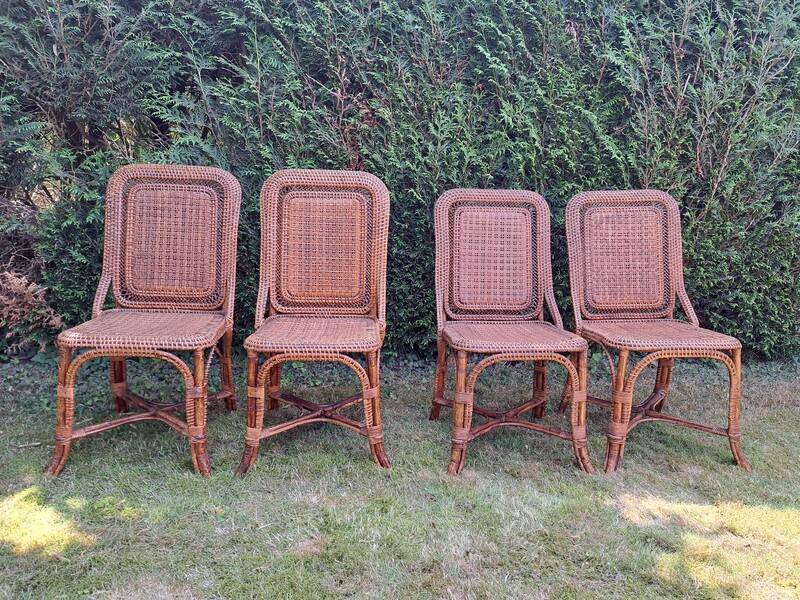 Set of 4 chairs by Perret and Vibert in bamboo and varnished rattan