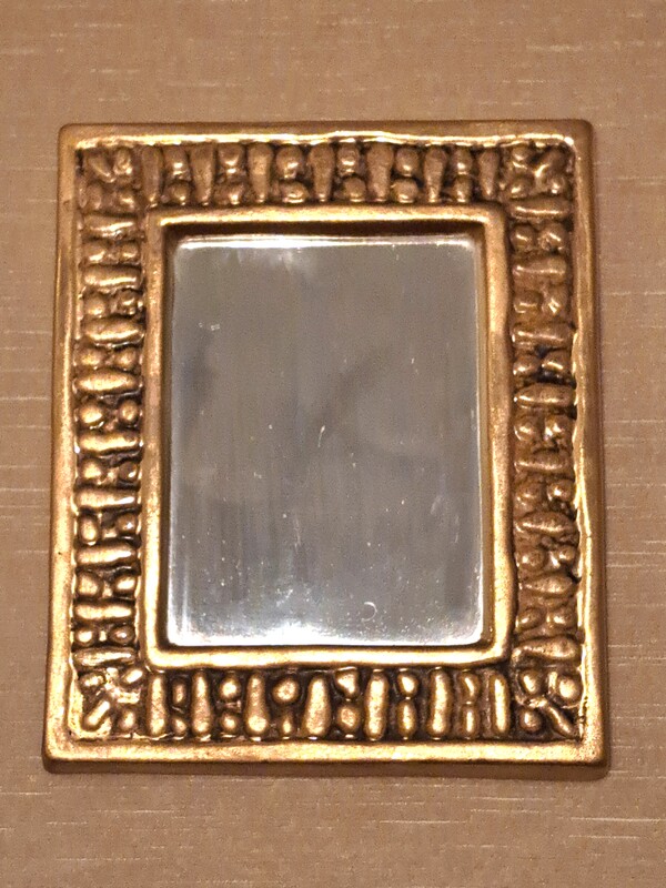 Small mirror signed François Lembo in gilded earthenware