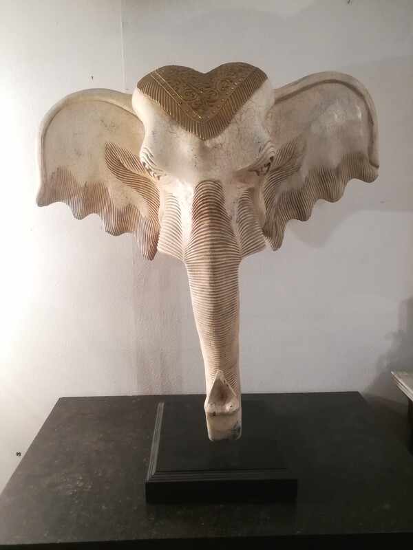 Wood painted elephant head on base